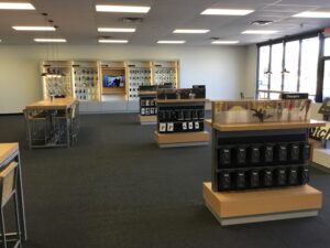 Verizon store interior showing iPhone displays and tablet displays 